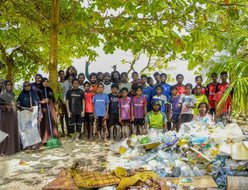 Community members gathered after a beach cleanup