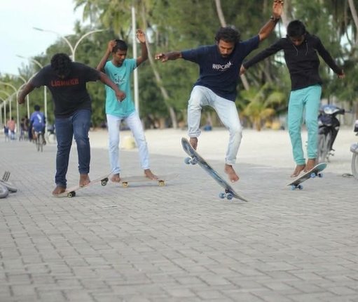 Young riders skateboarding together